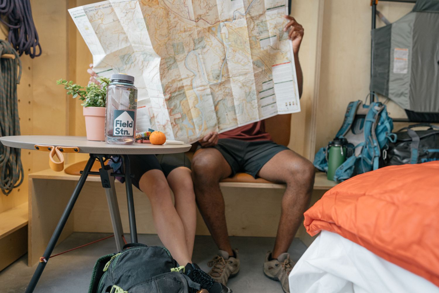 two people sitting down looking at a map